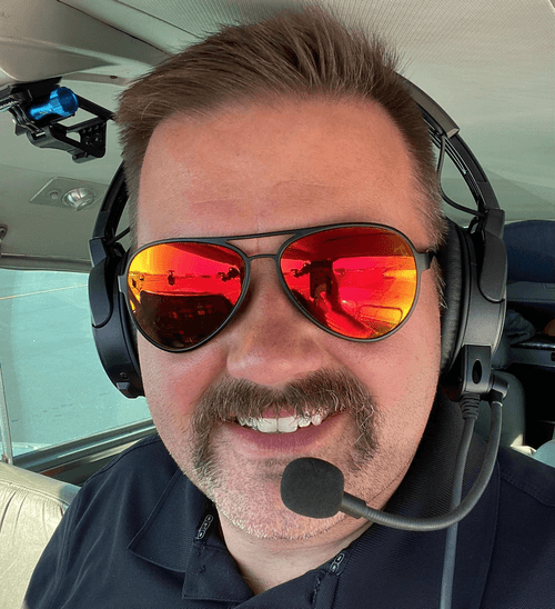 Pilot wearing Flying Eyes Cooper Aviator sunglasses with thin temples for headset comfort
