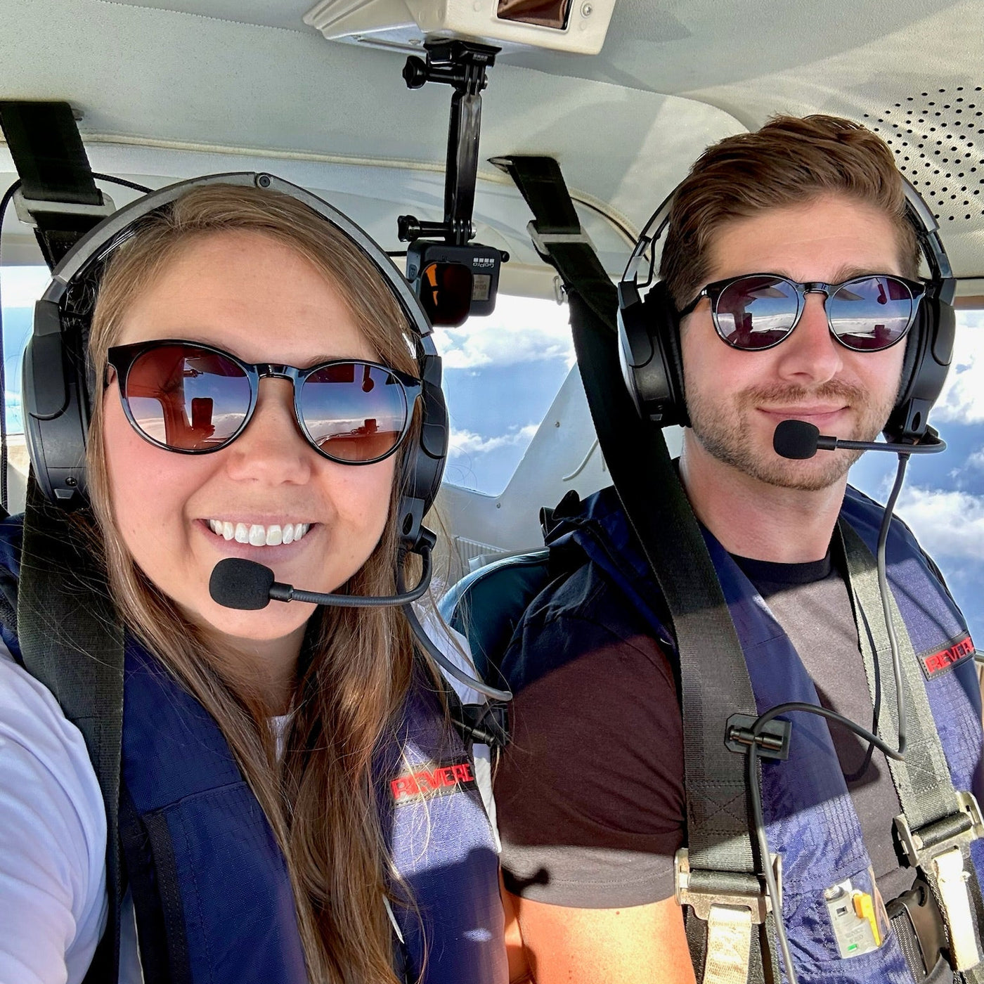 Fly Me To The Fun wearing circular glasses in a Cessna